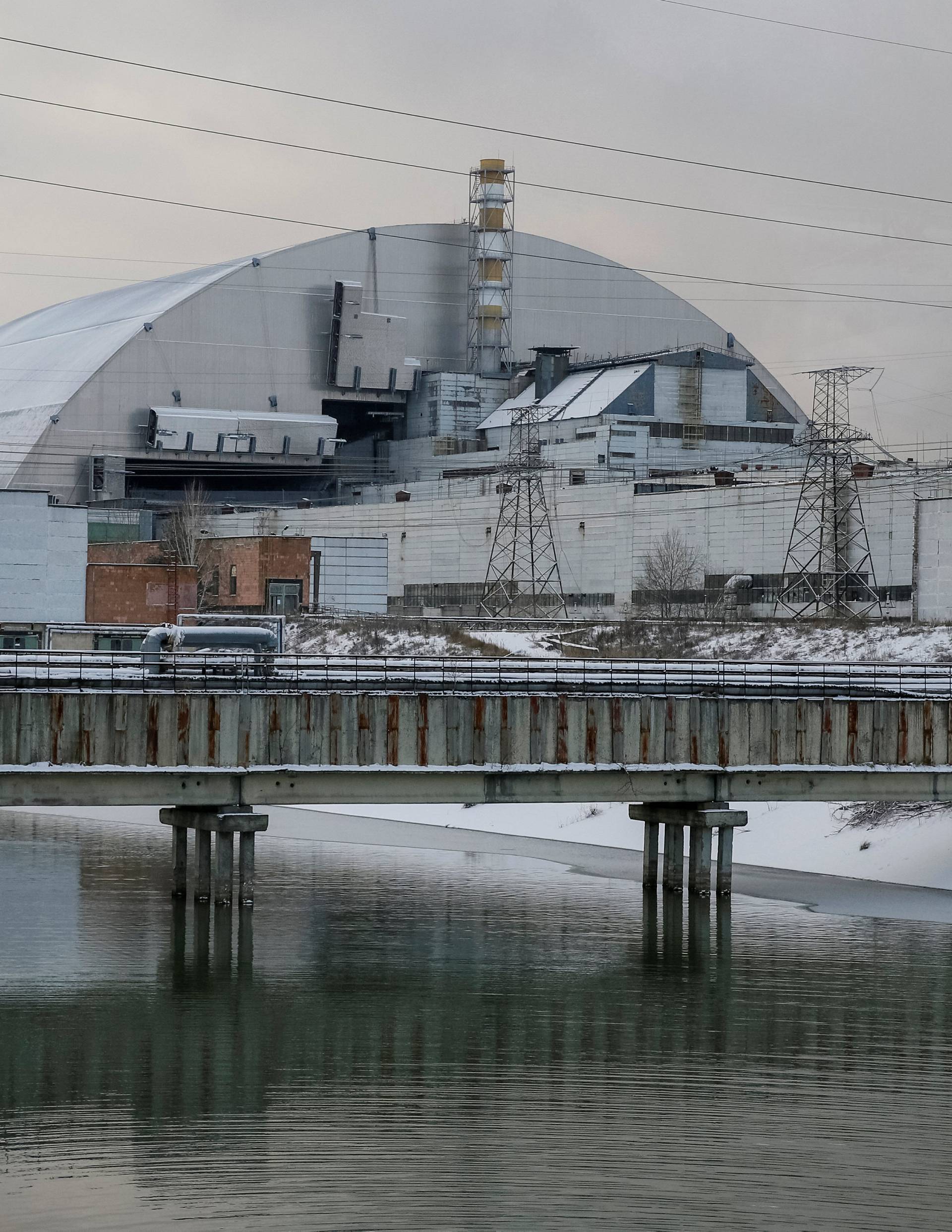 A general view shows a New Safe Confinement structure over the old sarcophagus covering the damaged fourth reactor at the Chernobyl nuclear power plant, in Chernobyl