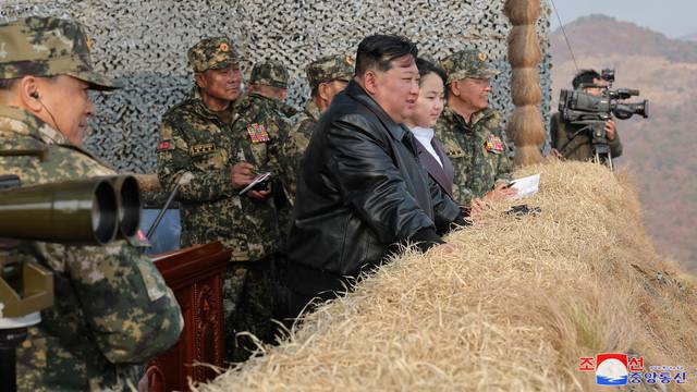 North Korean leader Kim Jong Un guides the training of the Korean People's Army's air and amphibious combat units