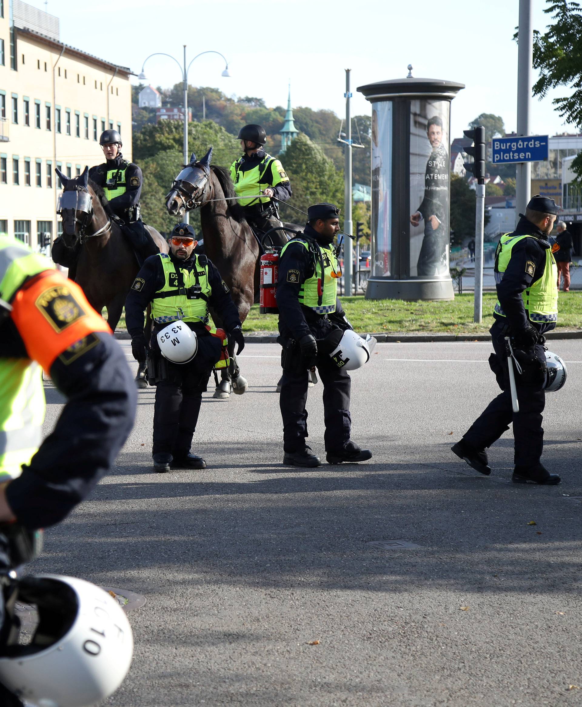 Police officers stand guard at a street prior to the Nordic Resistance Movement march in central Gothenburg
