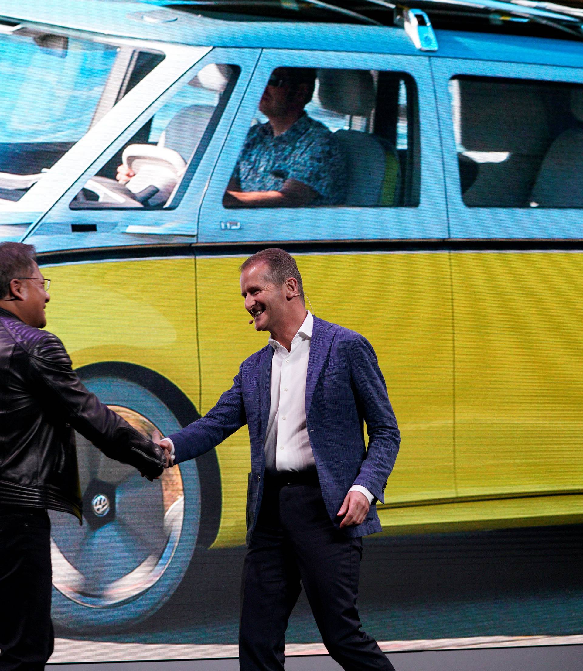 Jensen Huang, CEO of Nvidia, shakes hands with Volkswagen CEO Dr. Herbert Diess during the Nvidia  keynote address at CES in Las Vegas