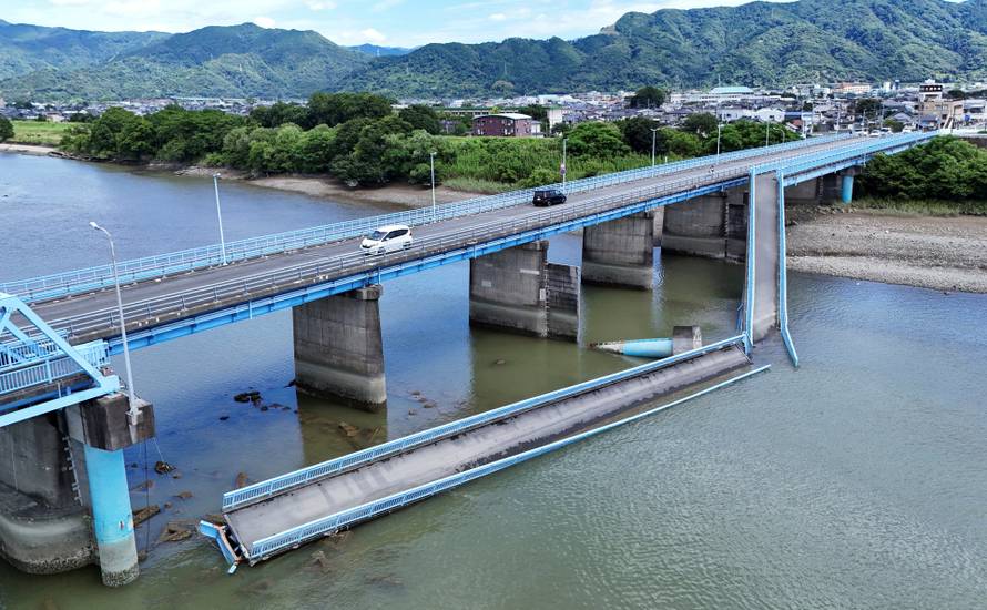 A drone view shows a damaged bridge after an earthquake with a magnitude of 7.1 struck Japan's southern Kumamoto Prefecture