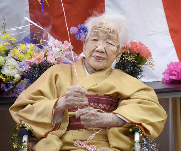 FILE PHOTO: Kane Tanaka, born in 1903, smiles as a nursing home celebrates three days after her 117th birthday in Fukuoka