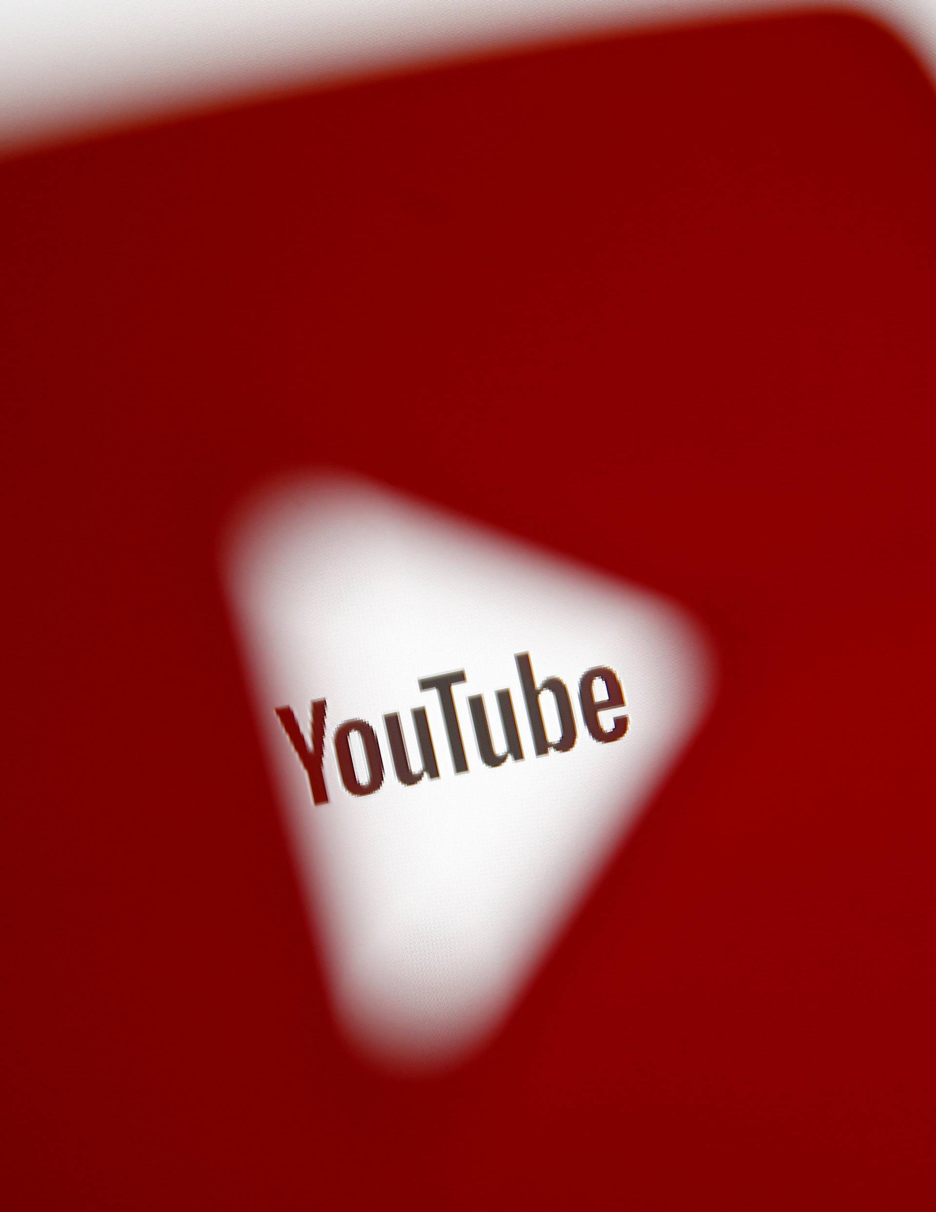 FILE PHOTO:    A 3D-printed YouTube icon is seen in front of a displayed YouTube logo in this illustration