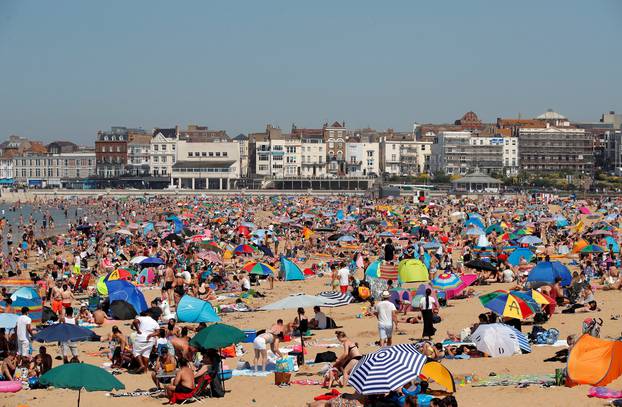 People enjoy the hot weather on Margate beach in Margate