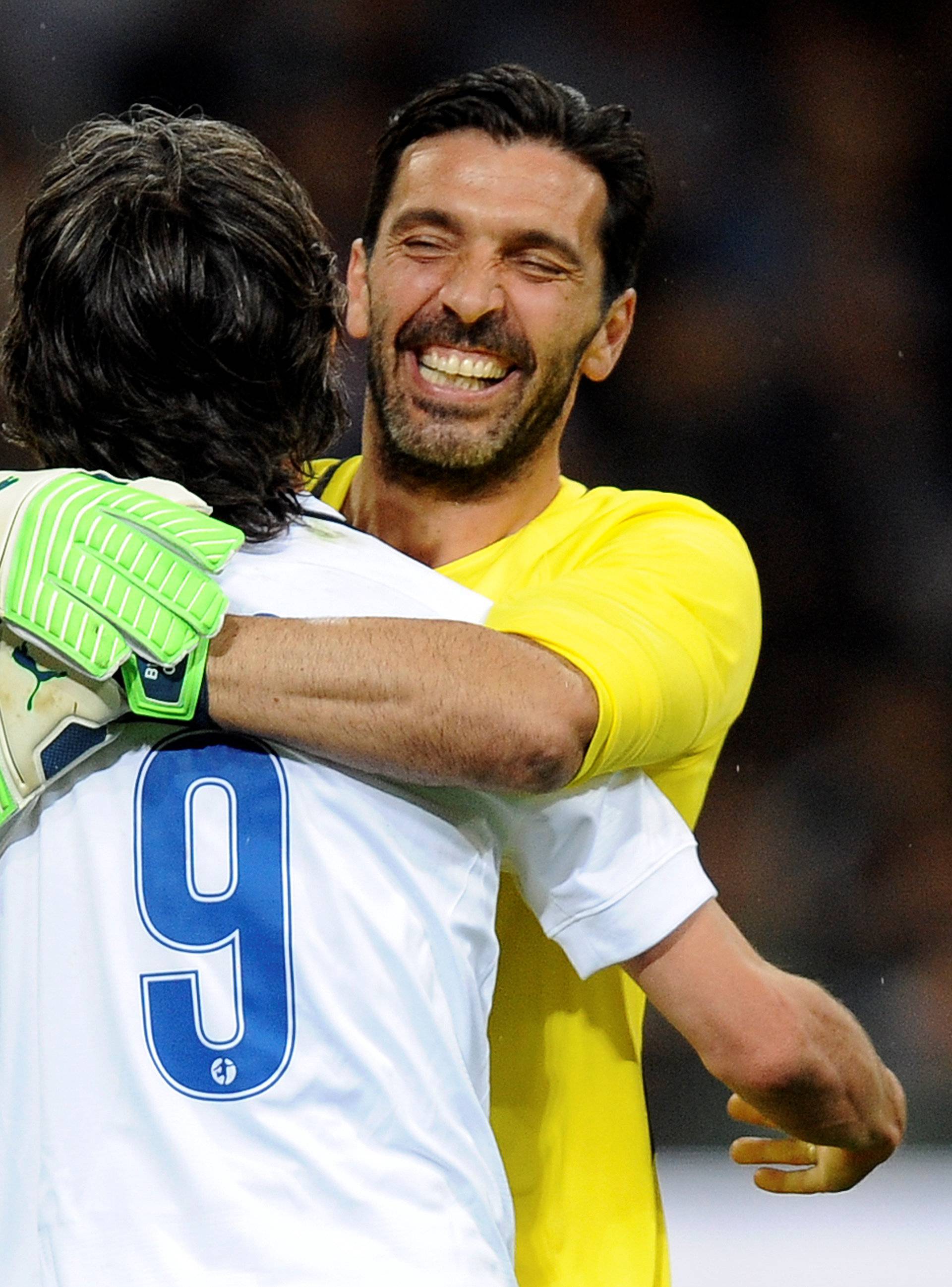 Former Italy's and Juventus goalkeeper Gianluigi Buffon embraces Filippo Inzaghi during Andrea Pirlo's farewell soccer match at the San Siro stadium in Milan