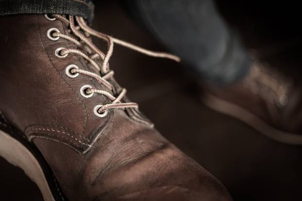old brown boot leather shoes, close-up image 