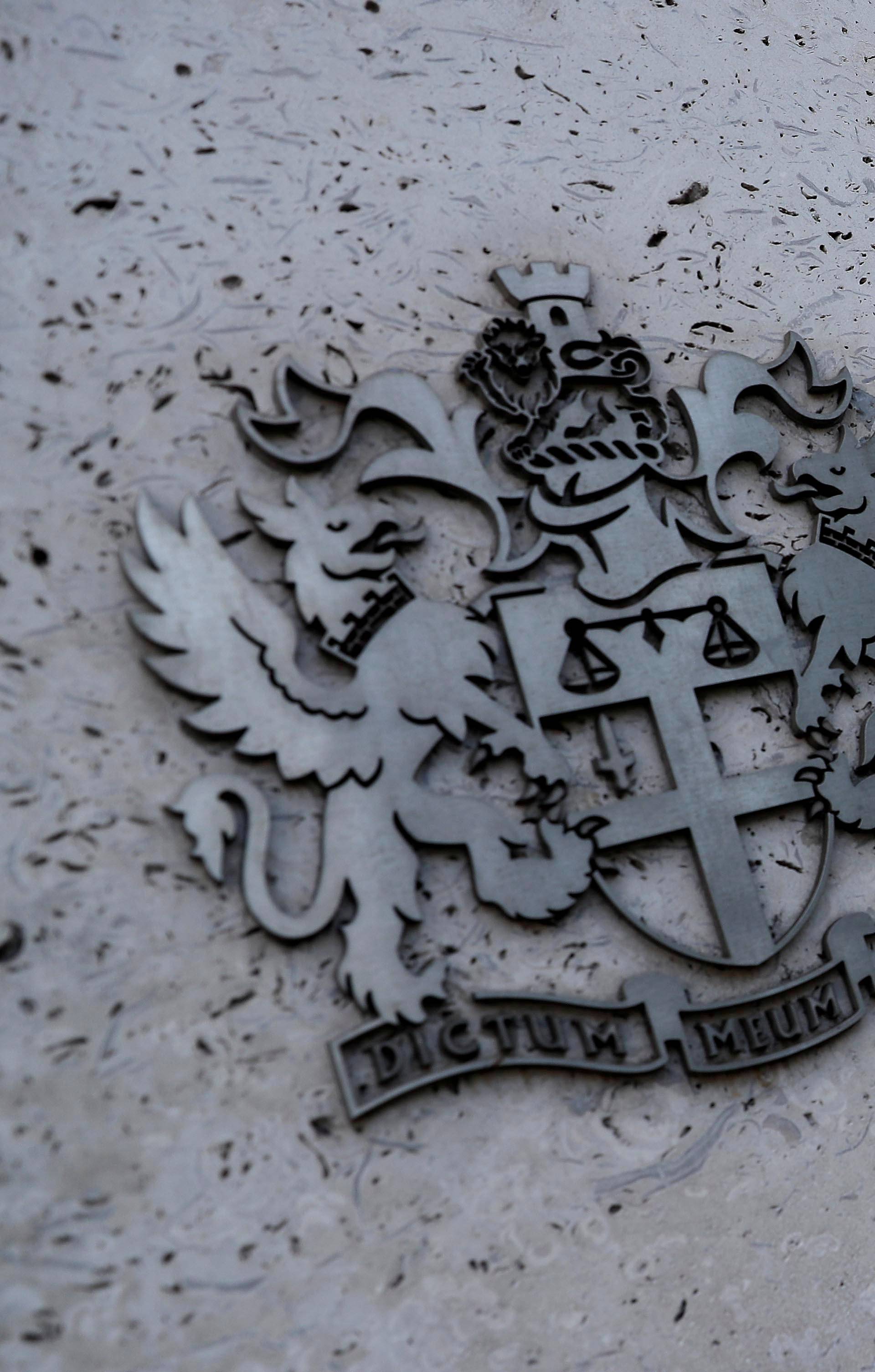 FILE PHOTO: Signage is seen outside the entrance of the London Stock Exchange in London