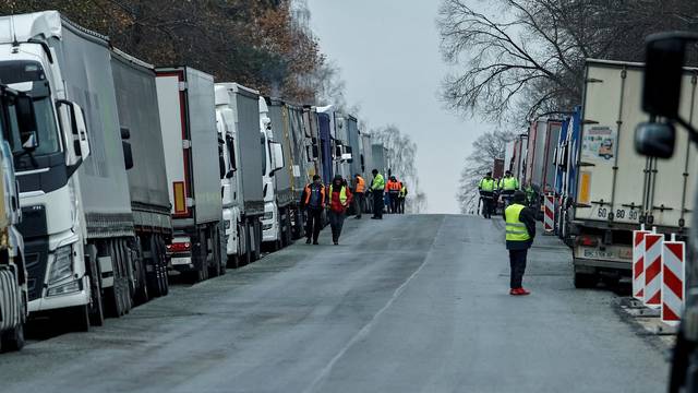 FILE PHOTO: Ukrainian trucks are parked near the Poland-Ukraine border, near the village of Korczowa