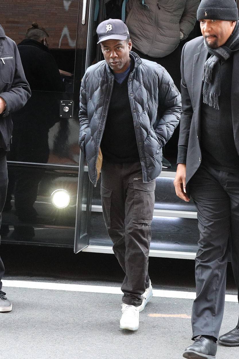 A downcast Chris Rock arrives at the Wilbur Theater for his first show