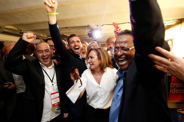 Supporters of French President-elect Emmanuel Macron, head of the political movement En Marche !, or Onwards !, react after announcement in the second round of 2017 French presidential election at En Marche local headquarters in Marseille