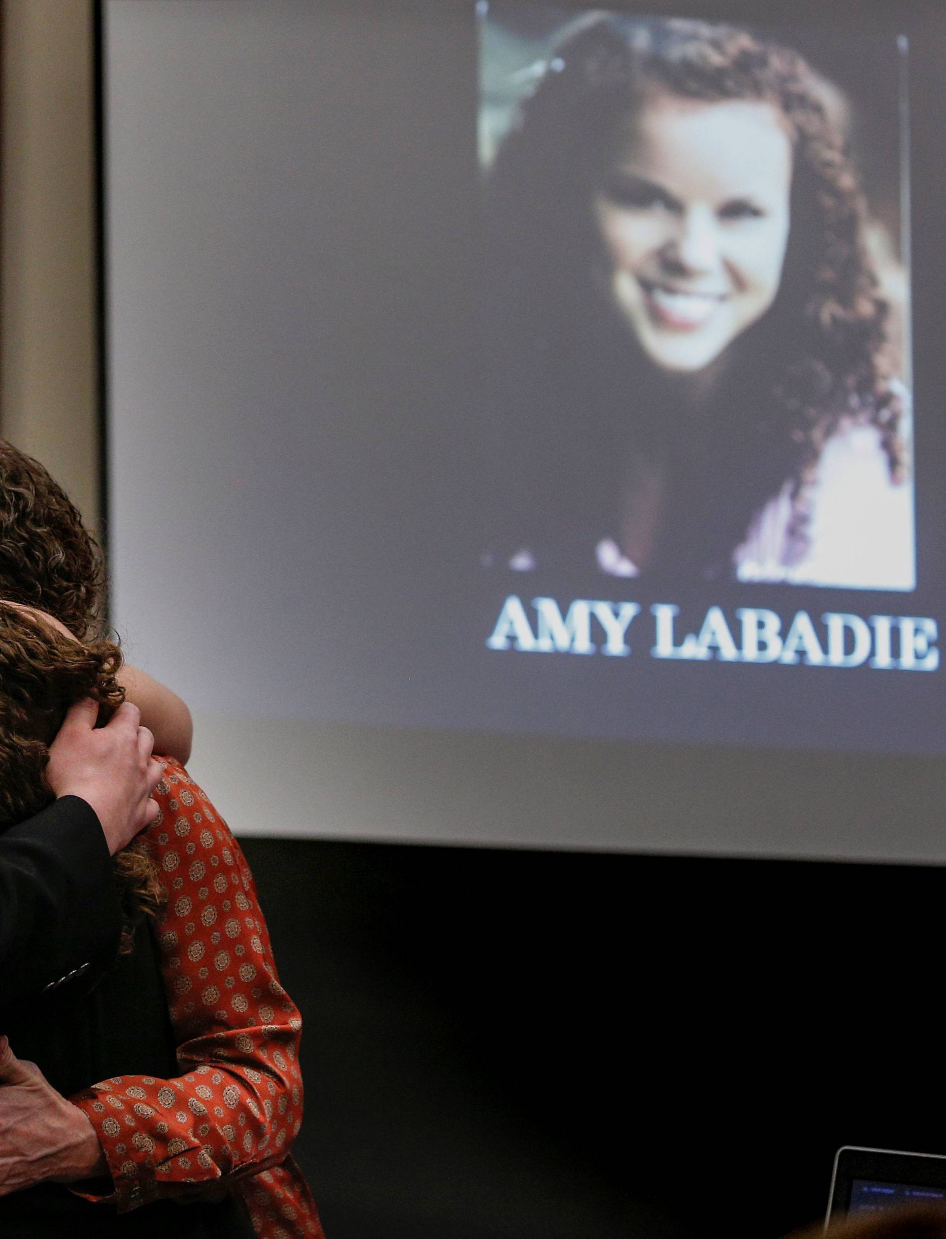 Victim Amy Labadie is comforted after speaking at the sentencing hearing for Larry Nassar, a former team USA Gymnastics doctor who pleaded guilty in November 2017 to sexual assault charges, in Lansing, Michigan