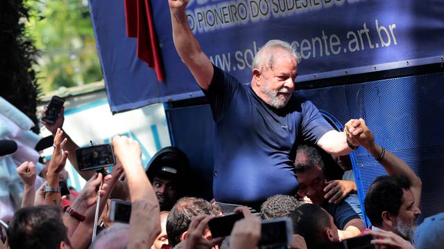 Former Brazilian President Luiz Inacio Lula da Silva is carried by supporters in front of the metallurgic trade union in Sao Bernardo do Campo