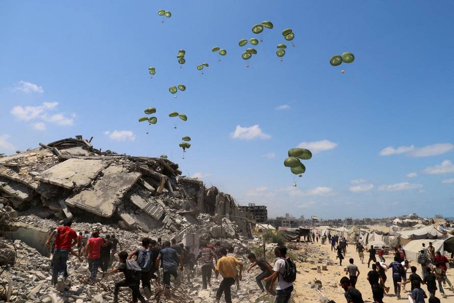 FILE PHOTO: Aid packages are airdropped over Gaza