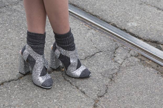 Detail of female shoes outside Gucci fashion show building for M