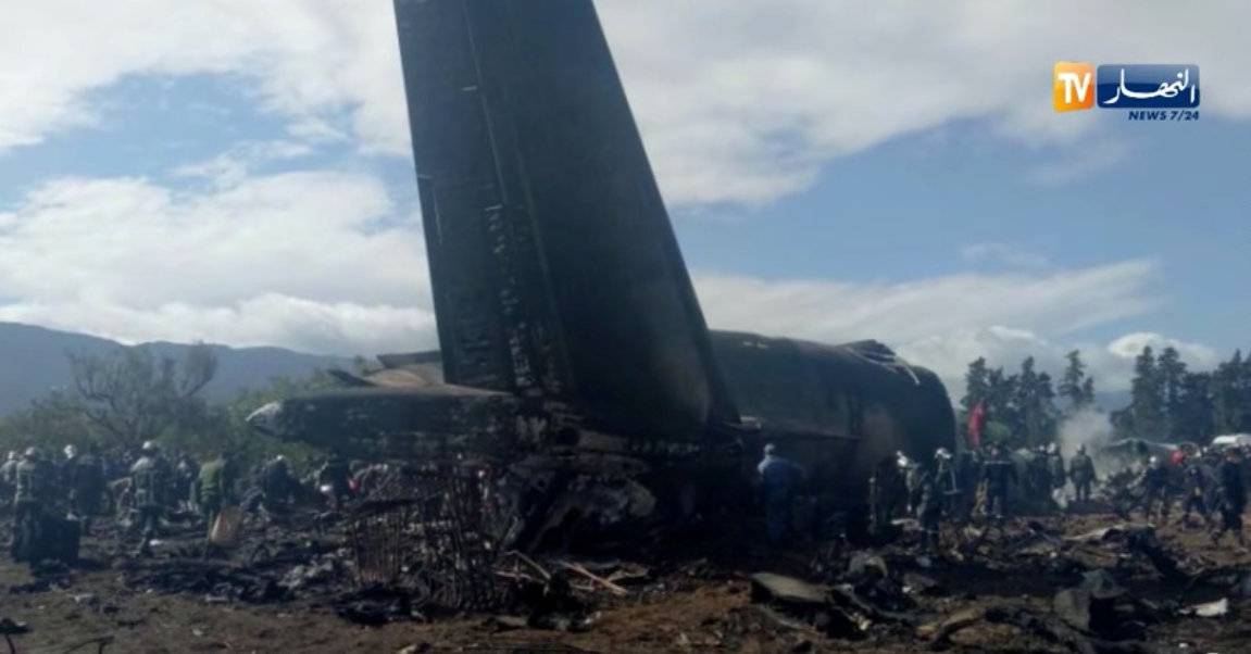 An Algerian military plane is seen after crashing near an airport outside the capital Algiers