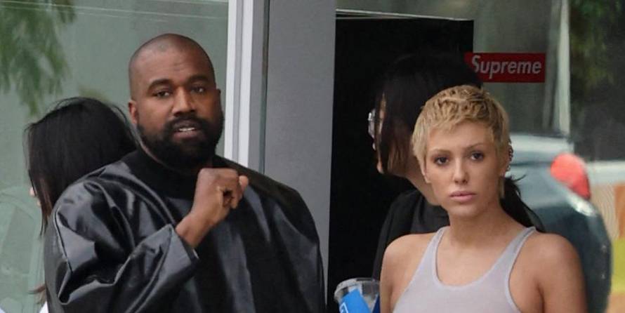 Kanye West seen in good spirits while shopping SUPREME and showing off his hummer with wife Bianca and friend