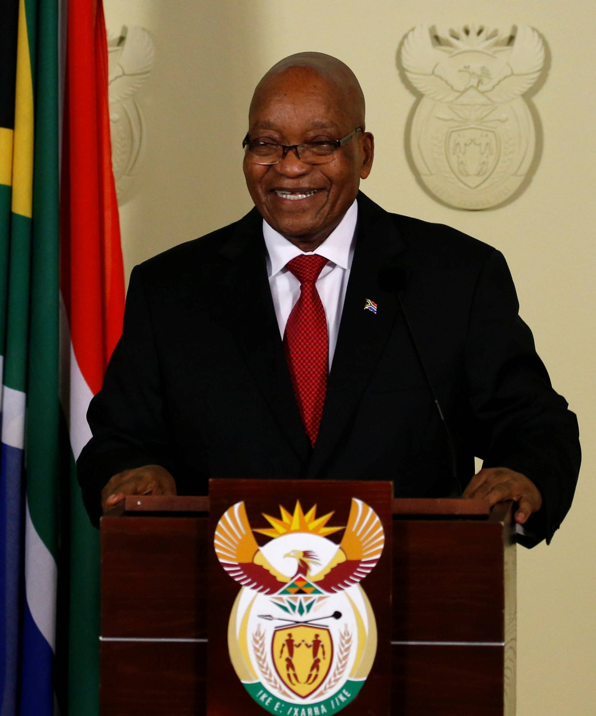 South Africa's President Jacob Zuma smiles as he arrives to speak at the Union Buildings in Pretoria