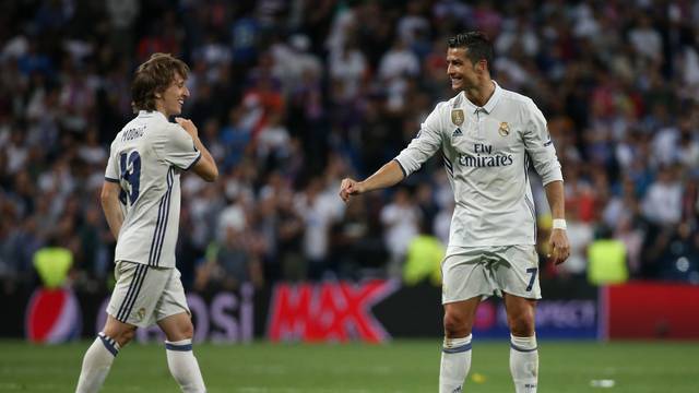 Real Madrid's Cristiano Ronaldo and Luka Modric celebrate after the match