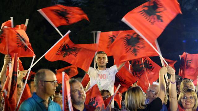 Supporters of Socialist Party wave their flags during a pre-election rally in Tirana, Albania