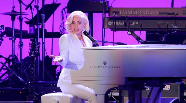 FILE PHOTO: Lady Gaga performs for the five former U.S. presidents, Jimmy Carter, George H.W. Bush, Bill Clinton, George W. Bush, and Barack Obama during a concert at Texas A&M University benefiting hurricane relief efforts in College Station