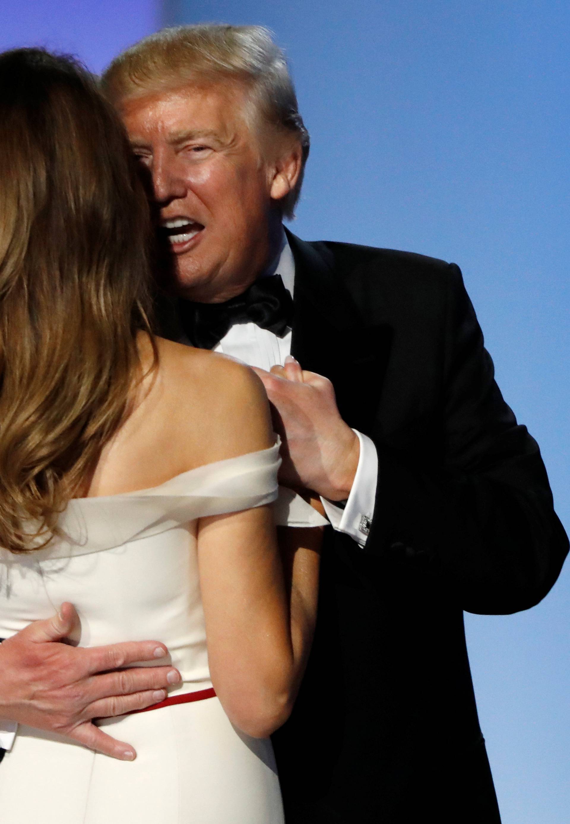 U.S. President Donald J. Trump hugs first lady Melania Trump as they attend the Inauguration Freedom Ball in Washington