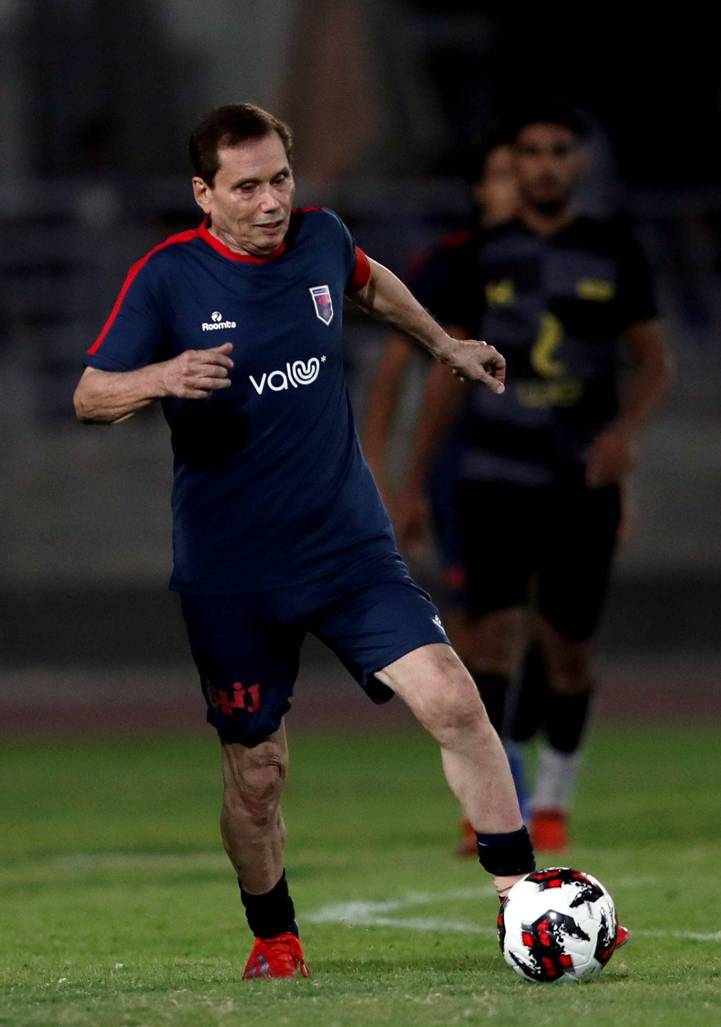 Ezzeldin Bahader, a 74-years-old Egyptian football player of 6th October Club is seen in action during a soccer match against El Ayat Sports Club of Egypt's third division league at the Olympic Stadium in the Cairo suburb of Maadi