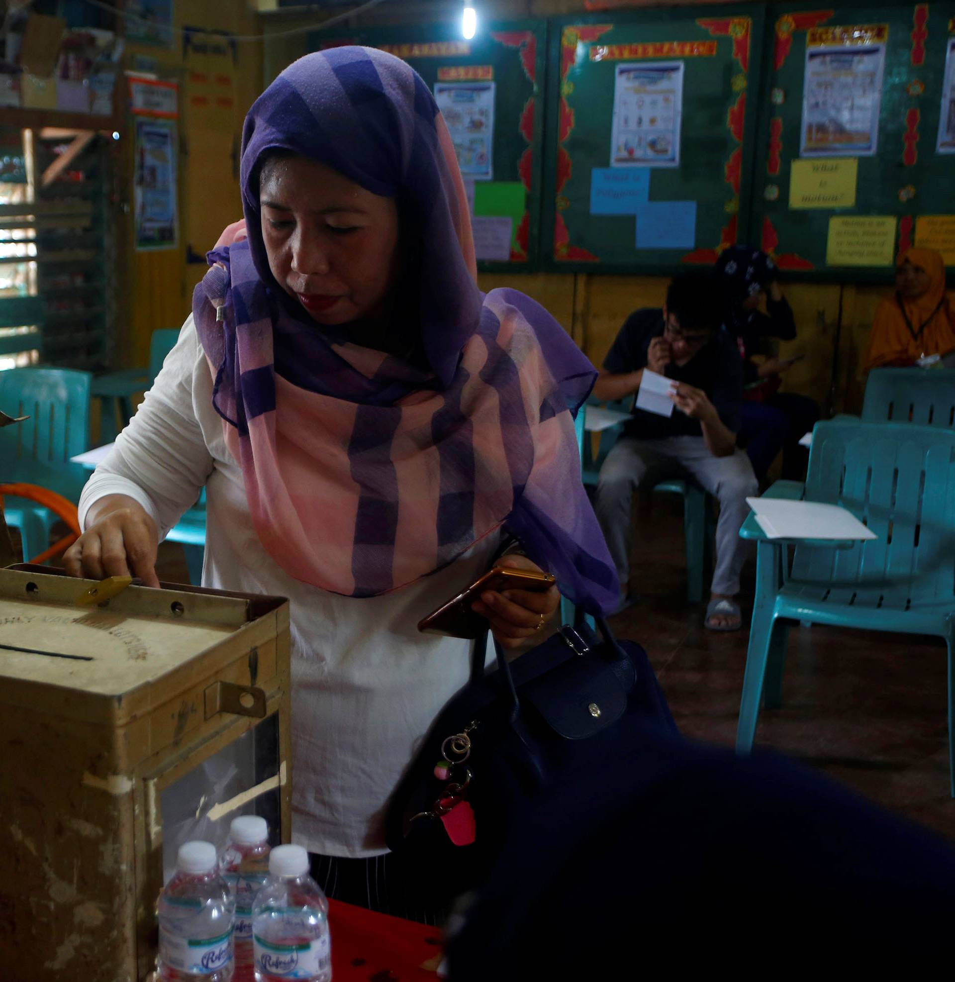 Woman casts her vote during the plebiscite on BOL at a voting precinct in Sultan Kudarat