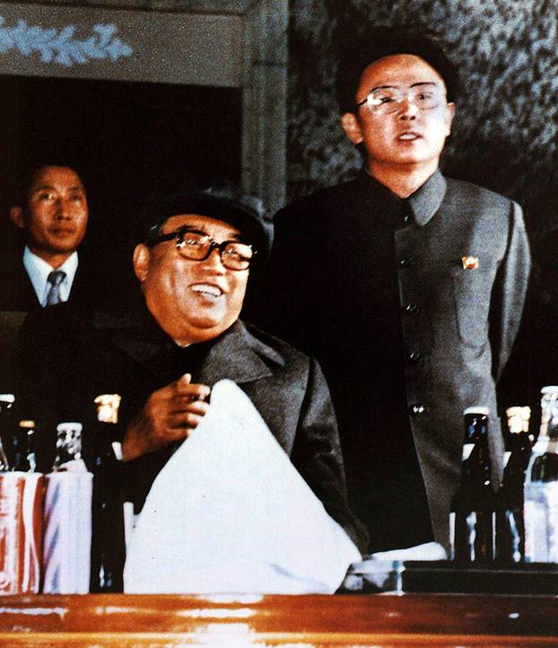 Korea: North Korean leader Kim Il Sung (seated) with his son and successor Kim Jong Il, Pyongyang, 1980