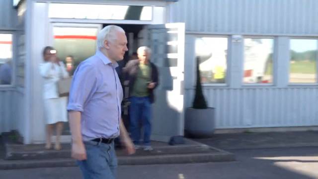 WikiLeaks founder Julian Assange boards a plane at a location given as London
