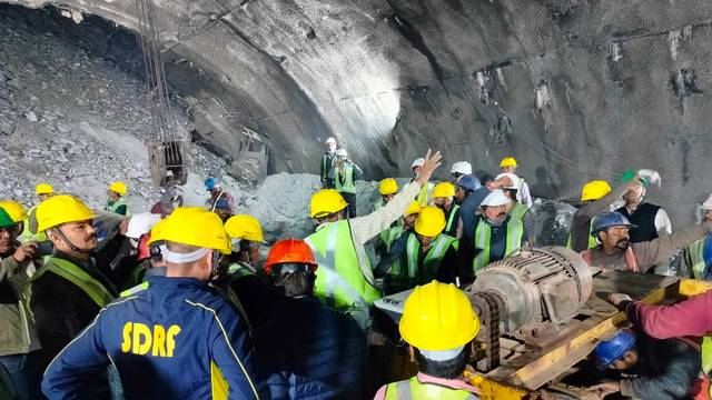Members of rescue teams prepare to conduct a rescue operation after a portion of an under-construction tunnel collapsed in Uttarkashi