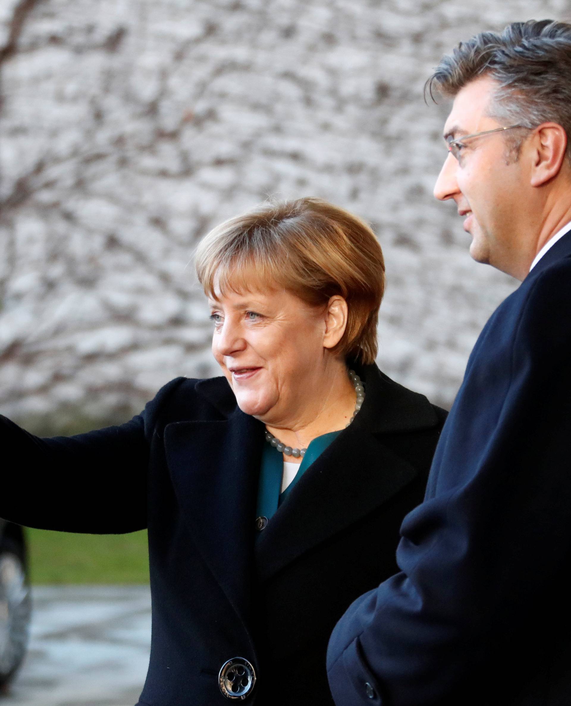 Croatia's Prime Minister Plenkovic is welcomed by German Chancellor Merkel at the chancellery in Berlin