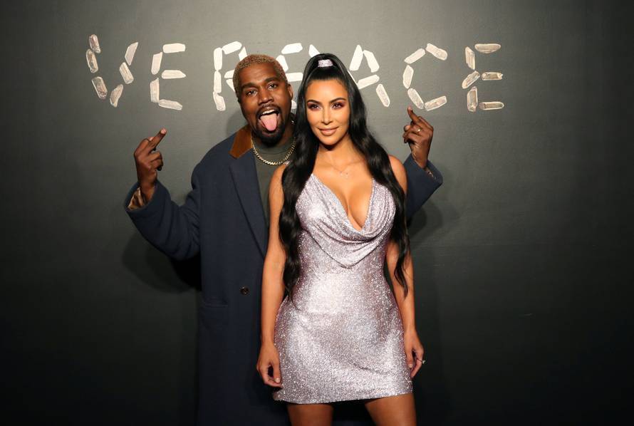 Kanye West and Kim Kardashian pose for a photo before attending the Versace presentation in New York