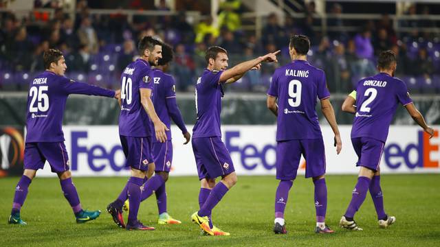 Fiorentina's Sebastian Cristoforo celebrates scoring their third goal with teammates