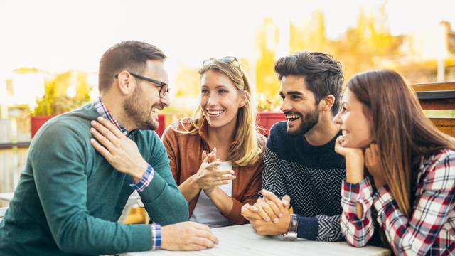 Group,Of,Four,Friends,Having,Fun,A,Coffee,Together.,Two