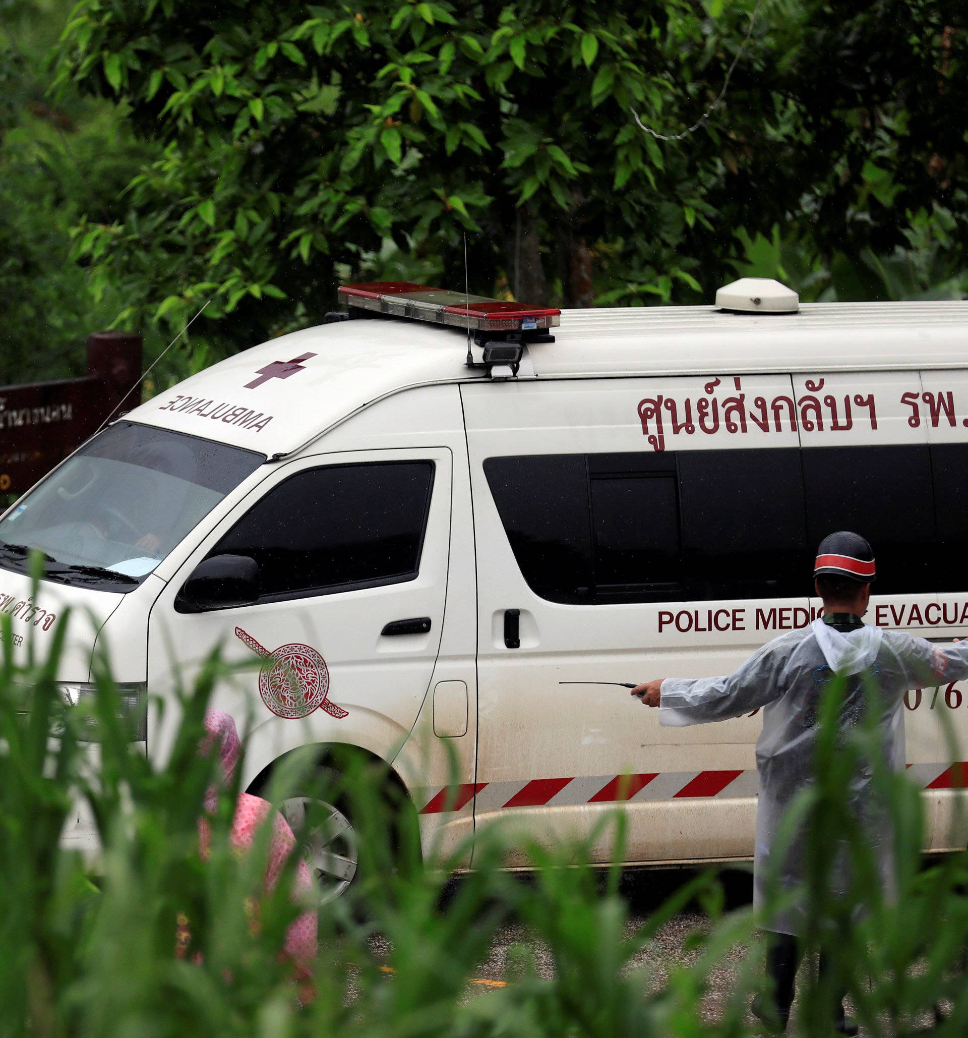 An ambulance departs from Tham Luang cave complex in the northern province of Chiang Rai