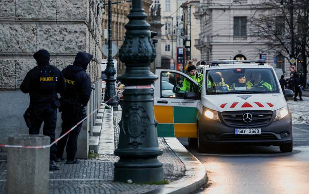 Members of the Police stand guard following a shooting at one of Charles University's buildings in Prague