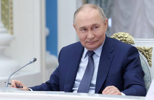 FILE PHOTO: Russian President Putin chairs a meeting in Moscow