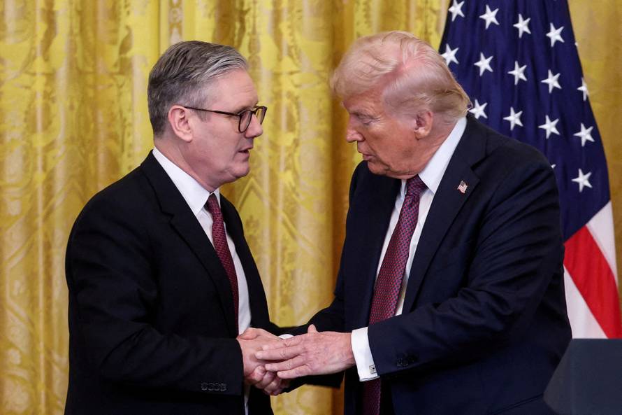 FILE PHOTO: U.S. President Donald Trump meets British Prime Minister Keir Starmer, in Washington, D.C.
