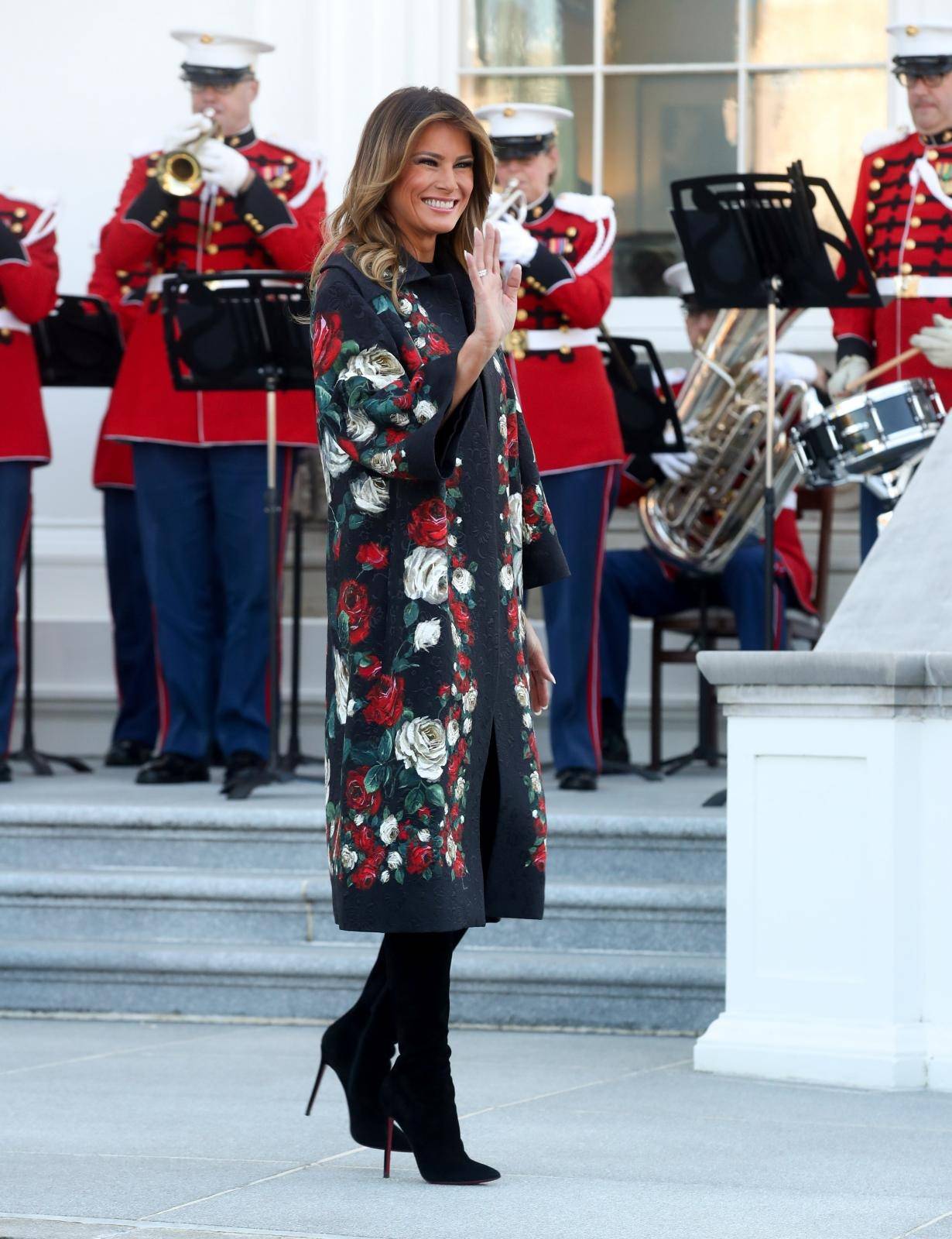 U.S. first lady Melania Trump walks out to receive the White House Christmas tree at the White House in Washington