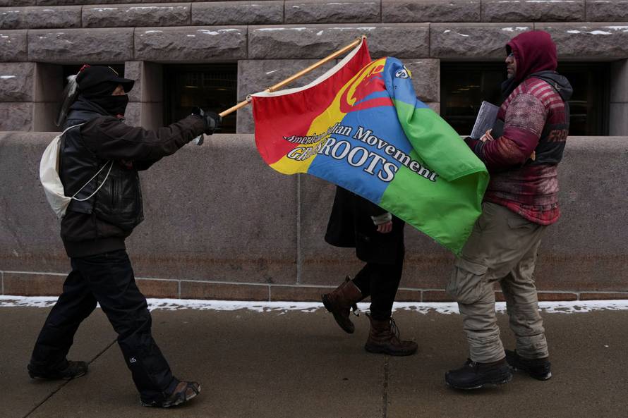 People attend the "March Against Minnesota Fraud" in Minneapolis