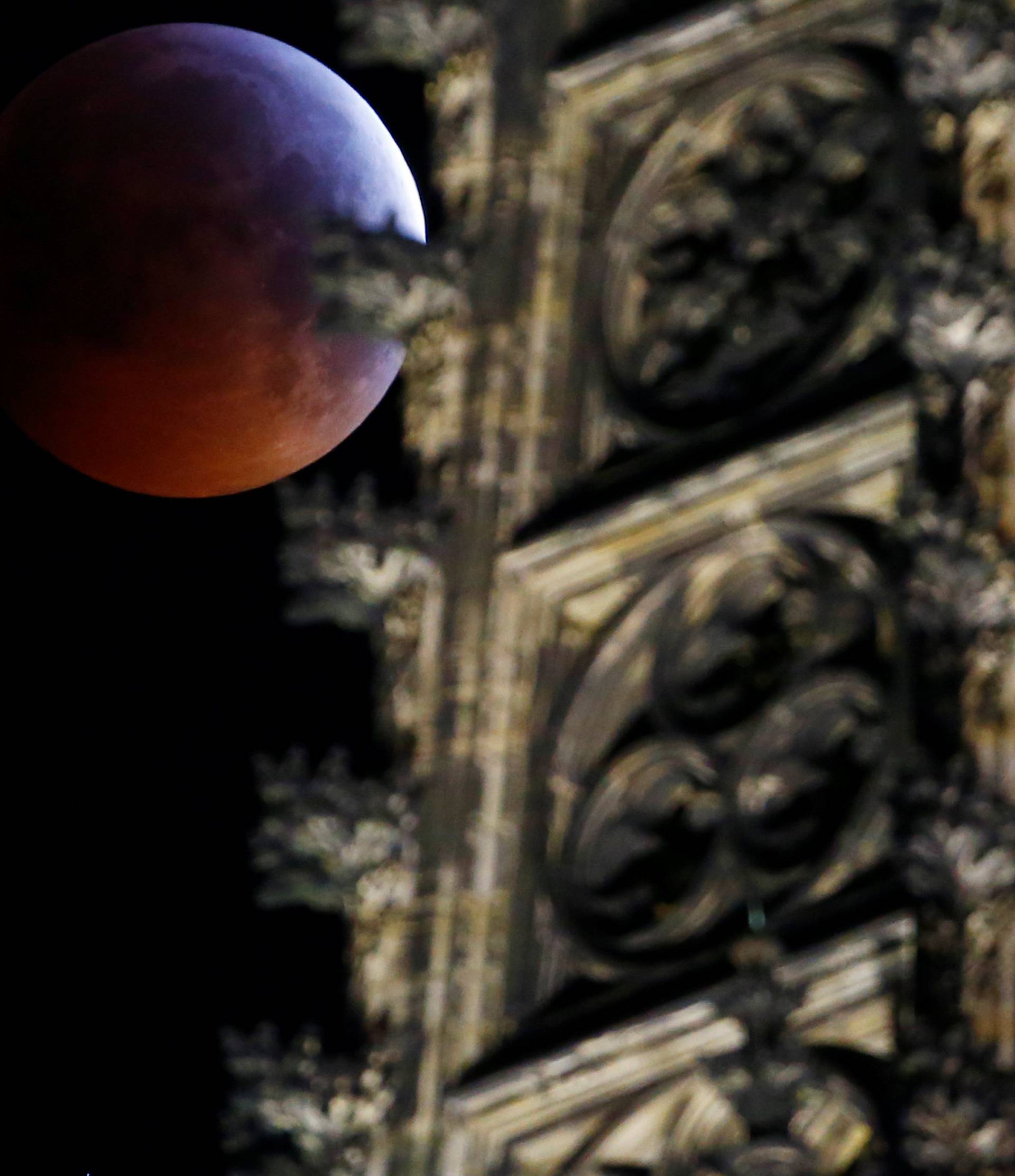 The "super blood wolf moon" is seen during a total lunar eclipse behind the gothic cathedral in Cologne