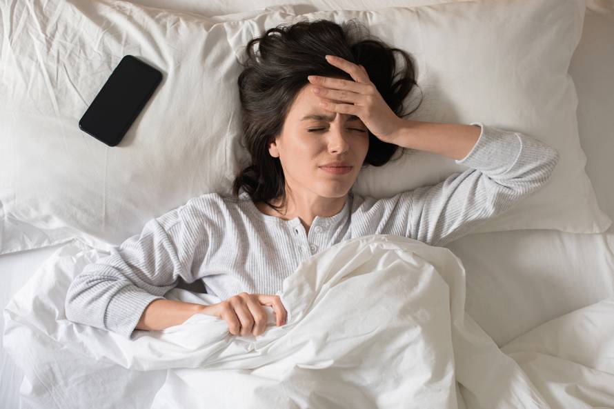 Sad,Young,European,Woman,Wakes,Up,,Presses,Her,Hand,To