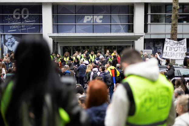 Students and anti-government protesters block access to the offices of RTS, in Belgrade