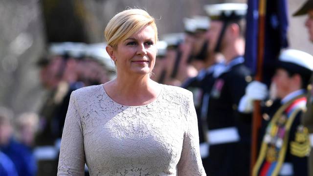 President of Croatia Kolinda Grabar-Kitarovic inspects an Australian military guard of honour during ceremonial welcome at Government House in Canberra