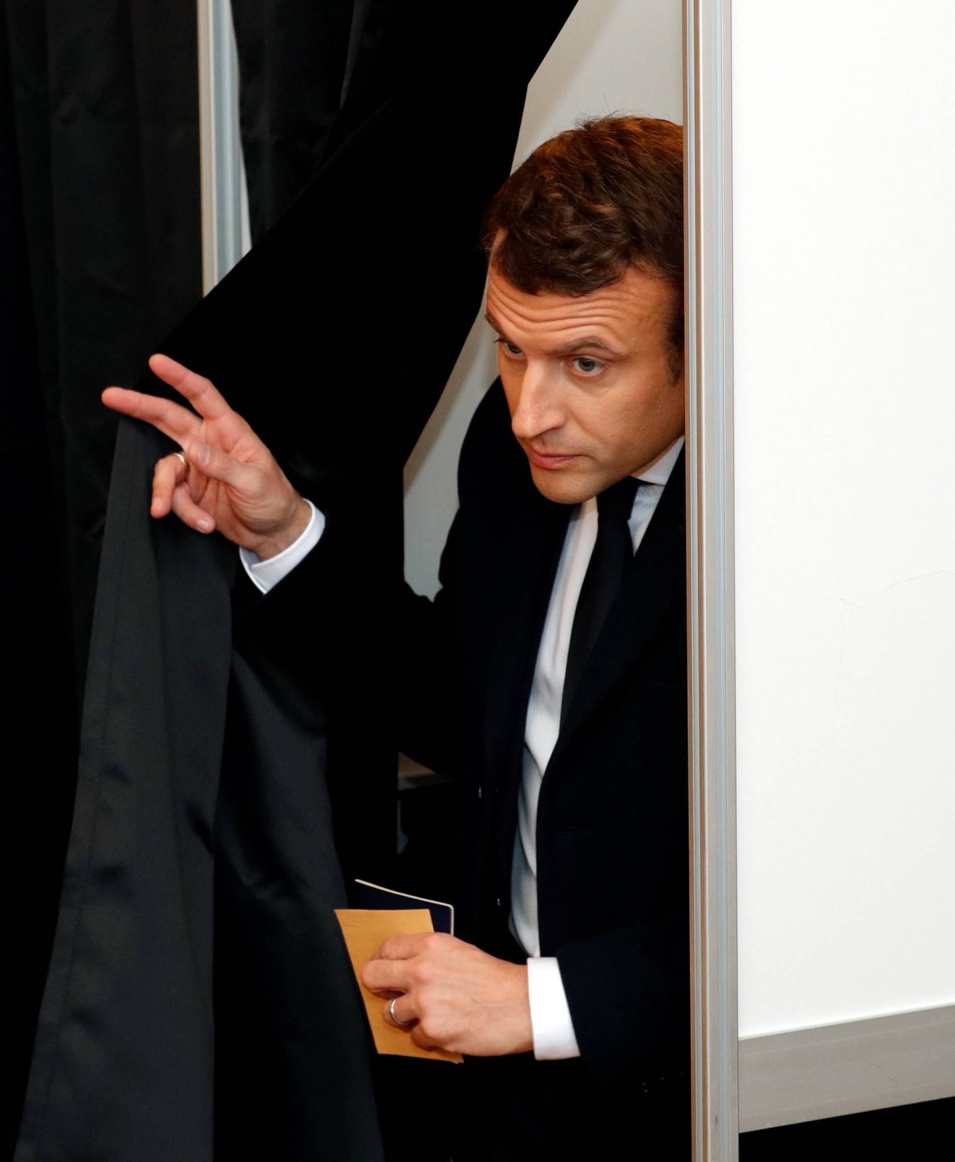 French presidential election candidate Emmanuel Macron at a polling station during the the second round of 2017 French presidential election, in Le Touquet