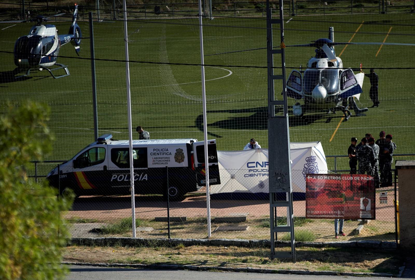 A body, believed to be of former Spanish Olympic skier Blanca Fernandez Ochoa, is surrounded by Spanish forensic technicians after being found at a mountain top in Cercedilla