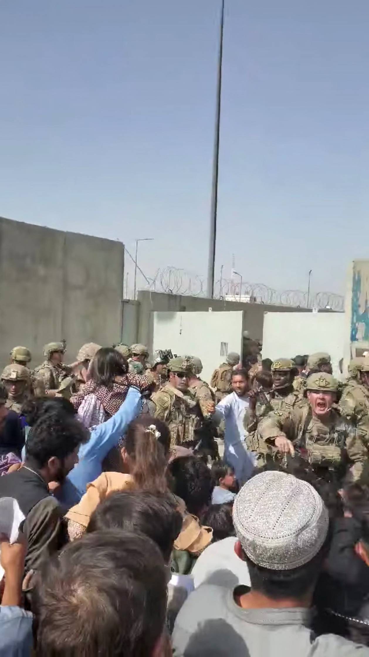 Afghanistan Special Forces try to disperse a crowd outside Kabul Airport