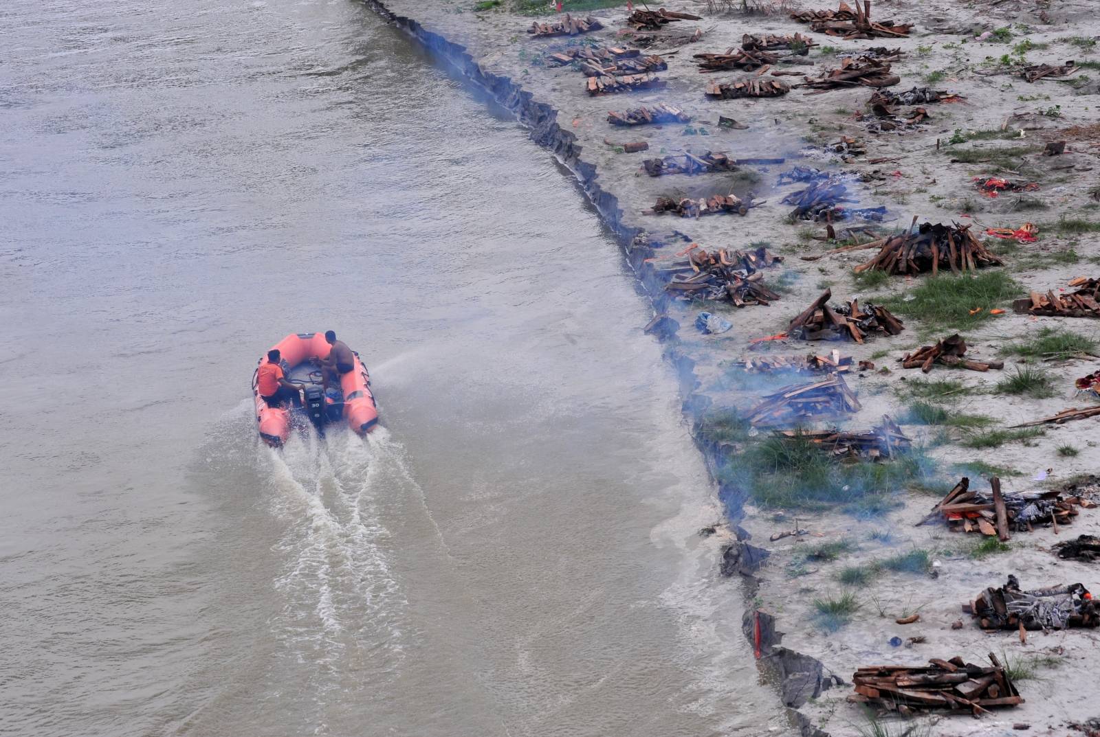 Monsoon exposes bodies buried in shallow sand graves in Phaphamau