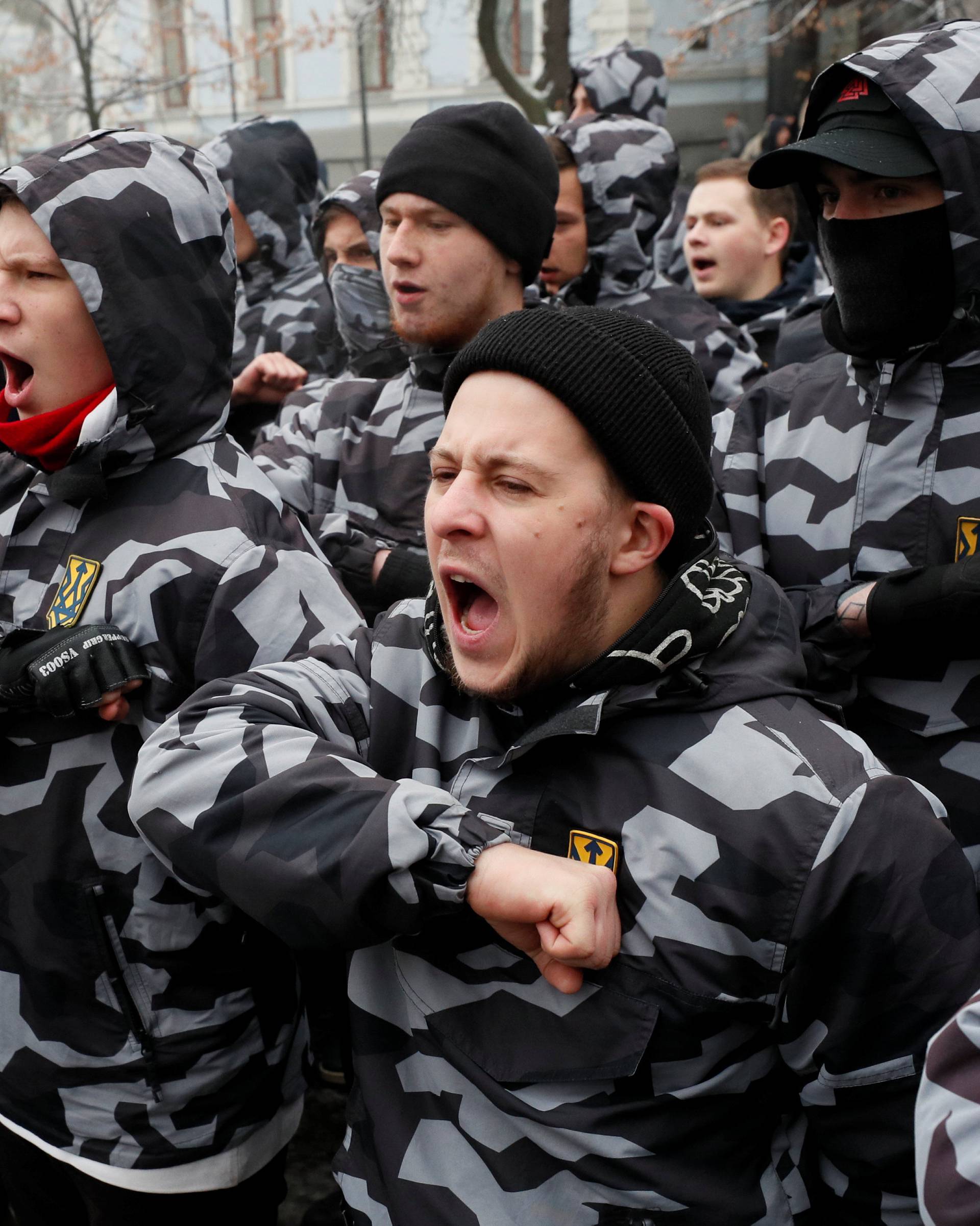 Activists of far-right parties shout slogans during a rally to support the Ukrainian navy after Russia seized two Ukrainian armored artillery vessels and a tug boat in the Black Sea, in front of the presidential administration headquarters in Kiev