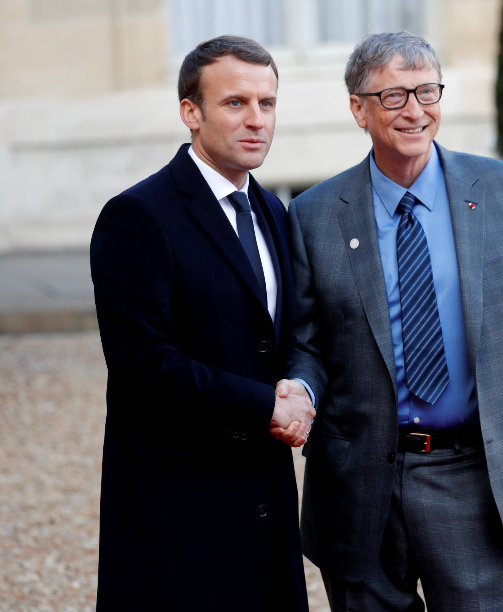 French President Emmanuel Macron welcomes Philanthropist and co-founder of the Microsoft Corporation Bill Gates for a lunch at the Elysee Palace as part of the One Planet Summit in Paris